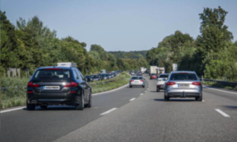 blurry 1080P dash cam footage of cars on highway with unclear license plates